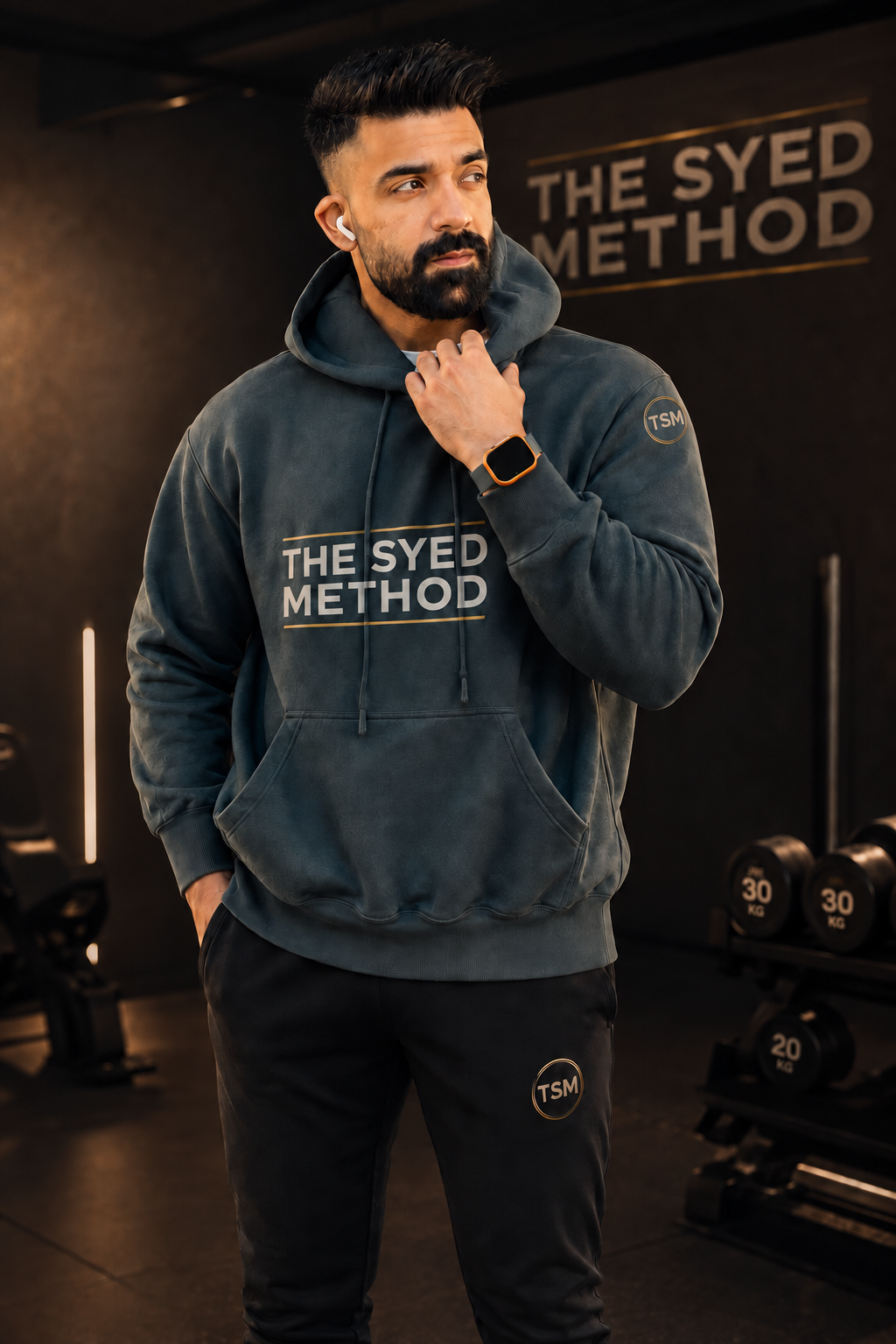 THE SYED METHOD hoodie worn in a gym setting